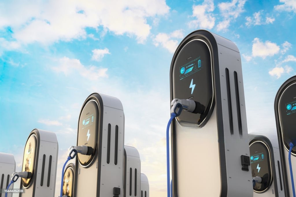 EV charging stations under a bright sky